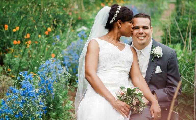 Bride kisses groom in garden at a Hudson Valley Wedding at Locust Grove in Poughkeepsie