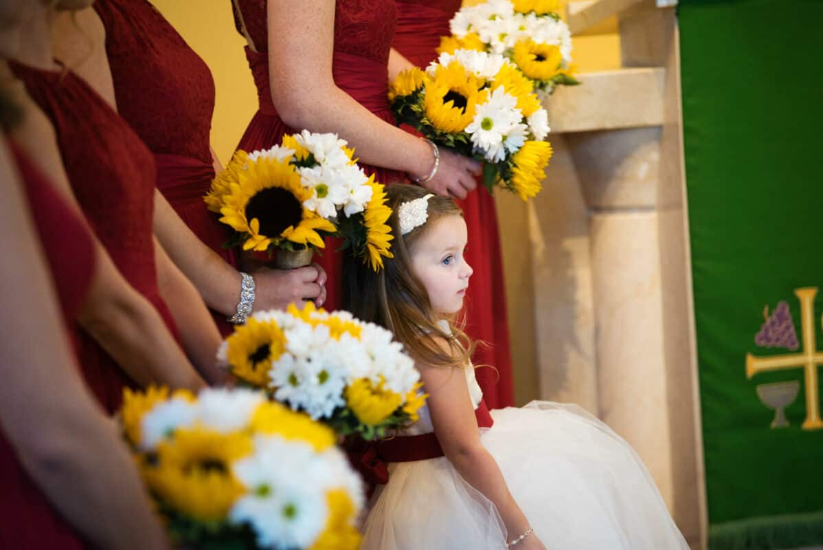 Flower Girl looks on at a Hudson Valley Wedding At West Hills Country Club In Middletown, New York
