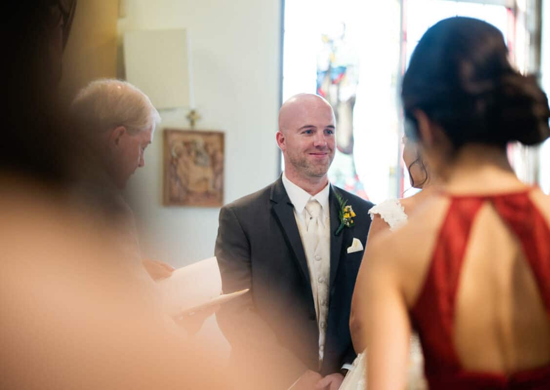 Groom smiles at Bride at a Hudson Valley Wedding At West Hills Country Club In Middletown, New York