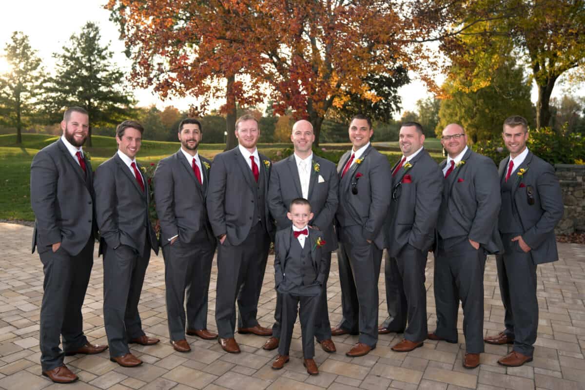 Groom poses with groomsmen at a Hudson Valley Wedding At West Hills Country Club In Middletown, New York