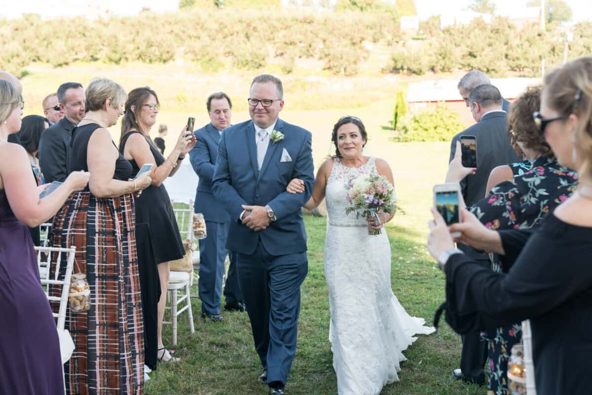 Brides processional with father at Hudson Valley Wedding at Nostranos Vineyard