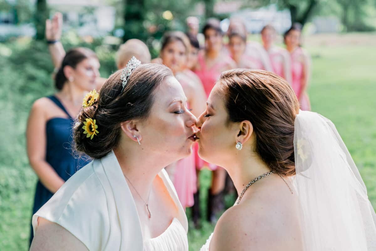 Bride kisses bride at bride at First look at Hudson Valleysame sex wedding At Lippincott Manor in Walkill New York