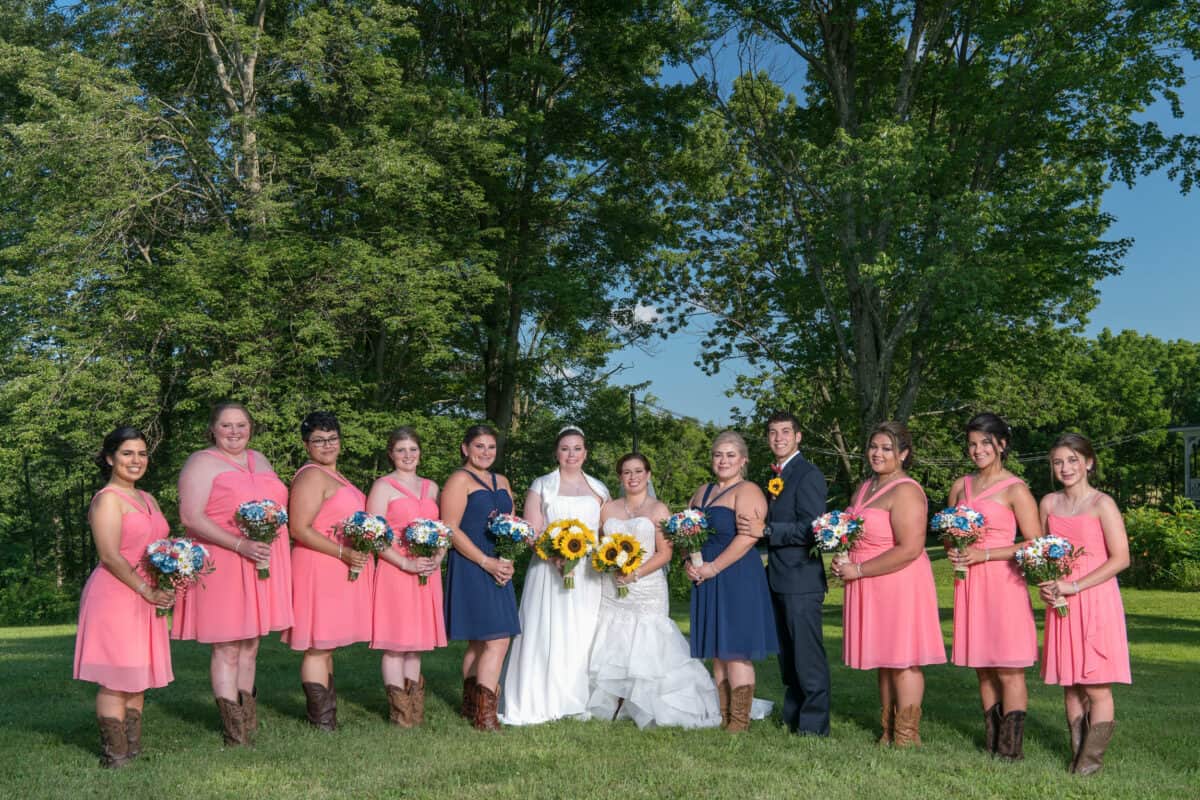 Bridal party pose for photo at Hudson Valley same sex wedding At Lippincott Manor in Walkill New York