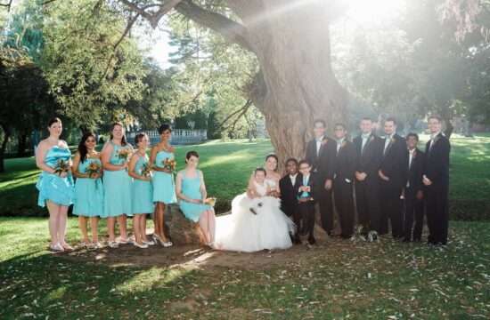 Bride and groom posing with bridal party by a tree at a Albany Wedding at The Factory Eatery