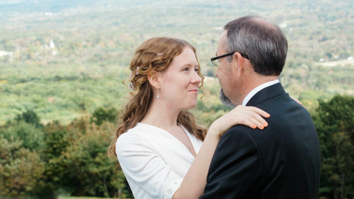 Brides looks into grooms eyes by Valley before ceremony at a Eagles Nest Wedding in the Hudson Valley