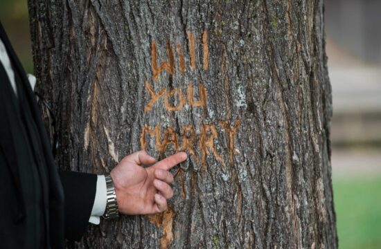 Groom carves note in tree before a Anthonys Pier Nine Wedding in the Hudson Valley
