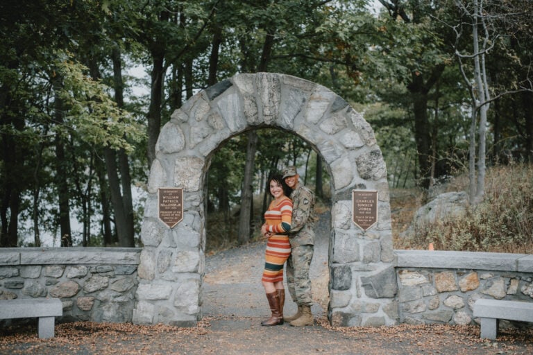 Bride and groom pose by Flirtation Walk Arch for West Point Engagement Photography