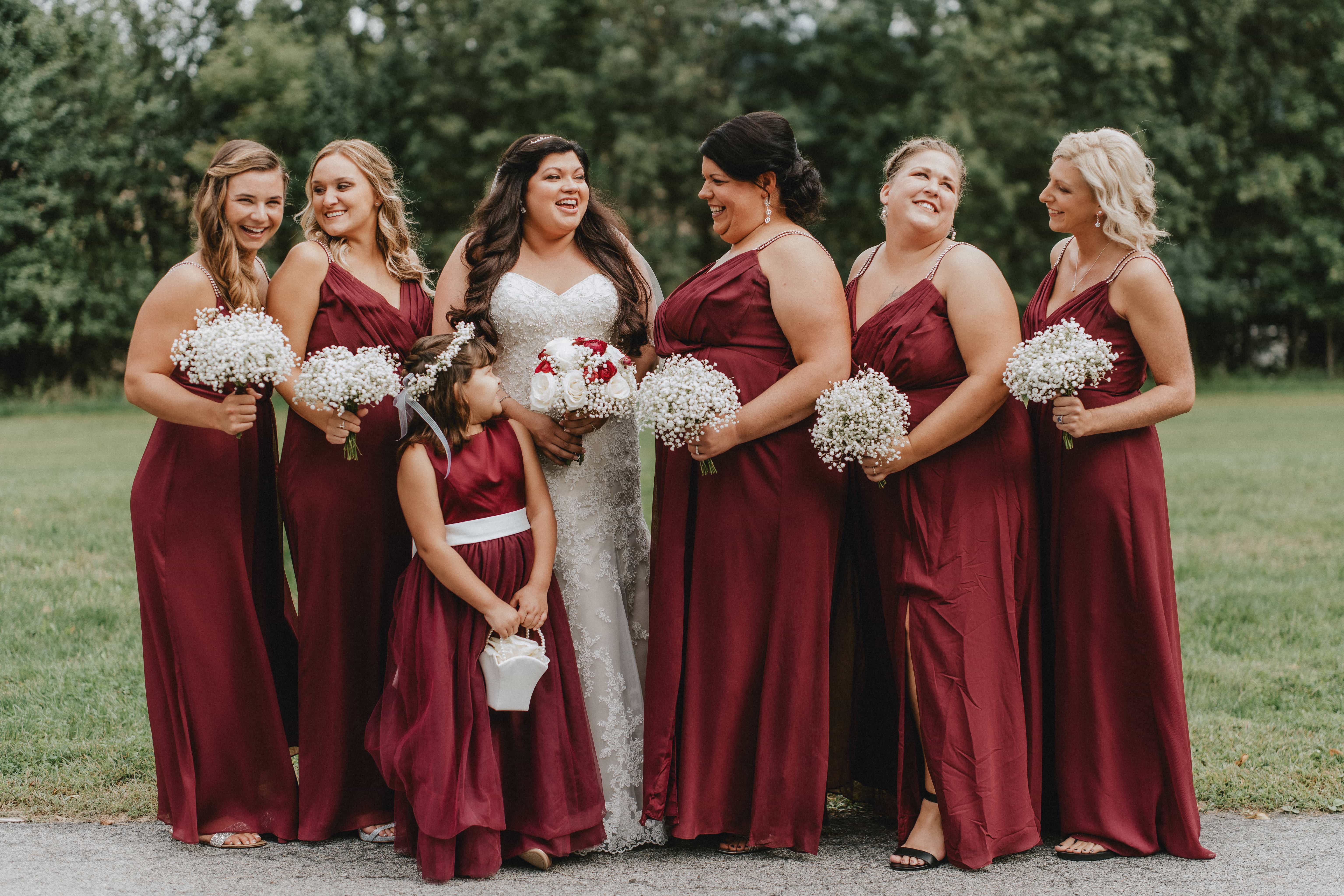 Bride poses with bridesmaids at a Hudson Valley Wedding at Brotherhood Winery