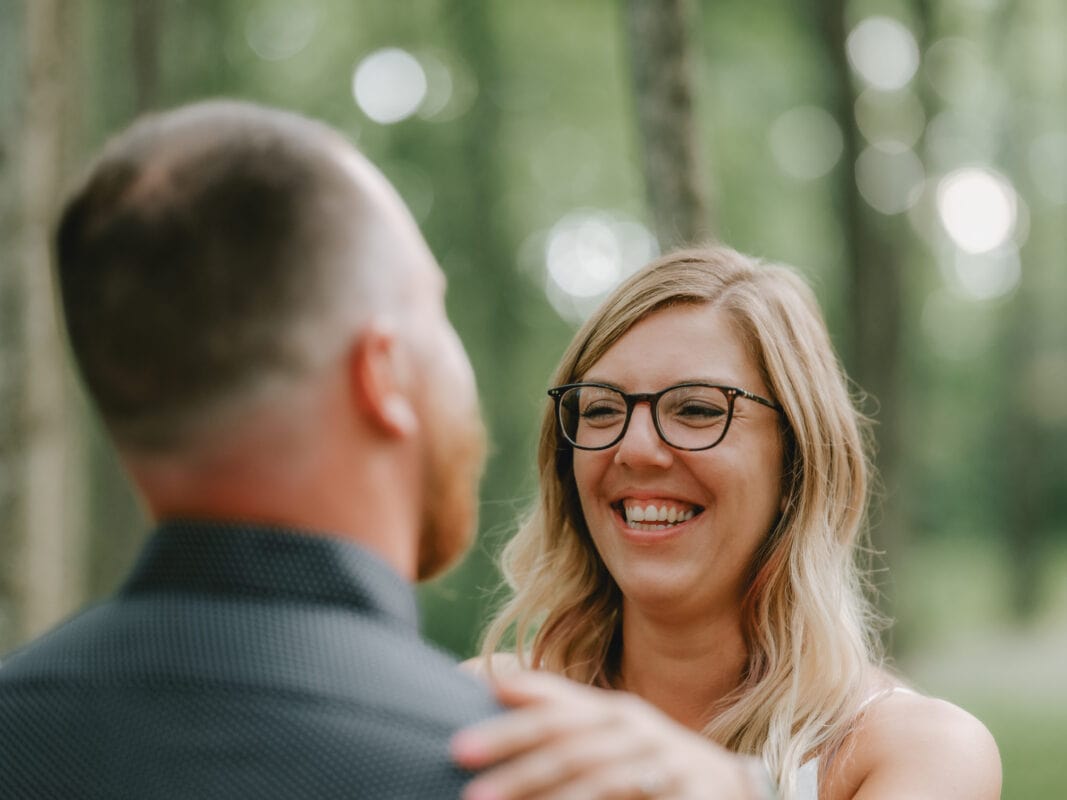 Bride smiles at Groom at a engagement shoot at Wallkill River Streamside Park