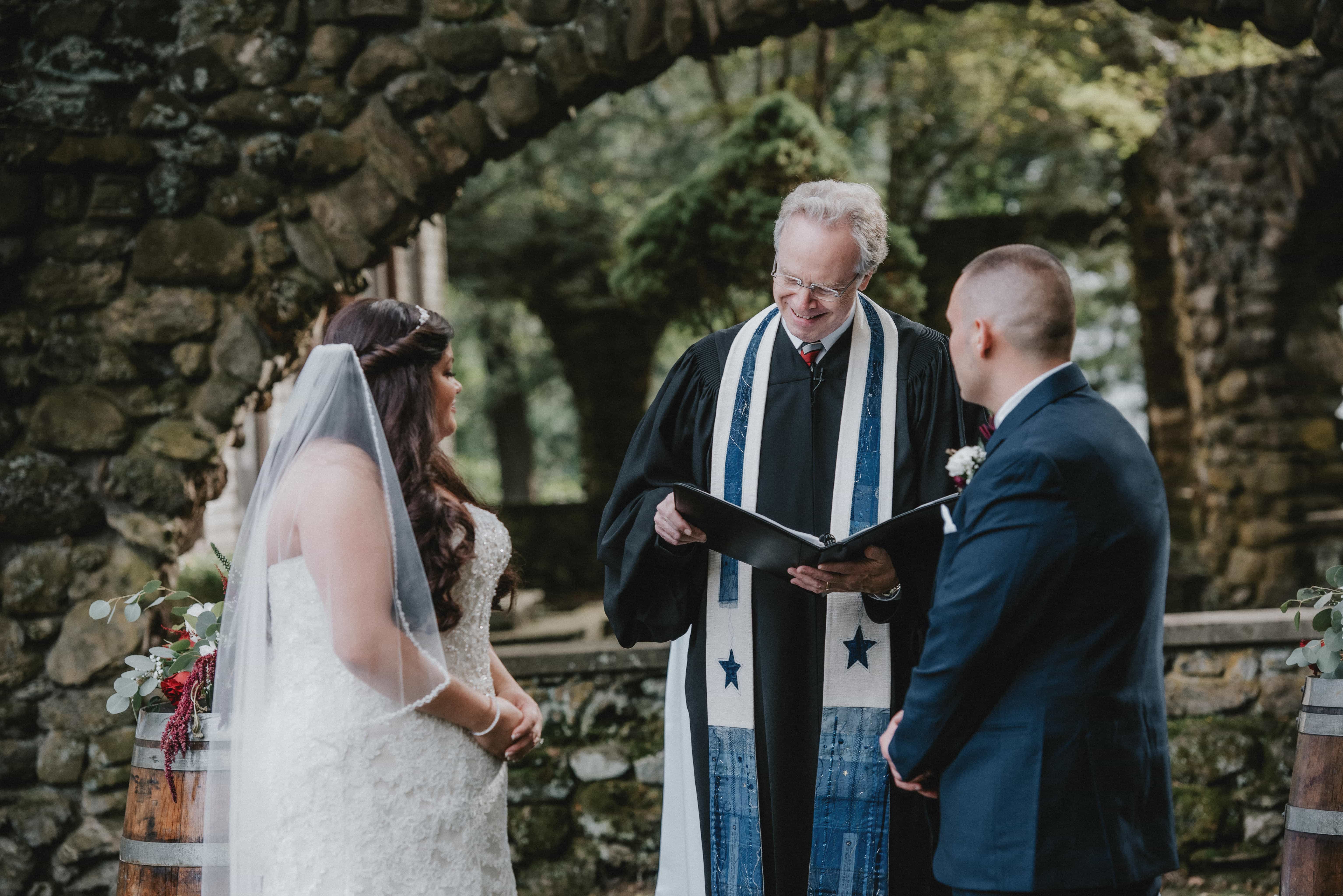 Pastor speaks during Ceremony at a Hudson Valley Wedding at Brotherhood Winery