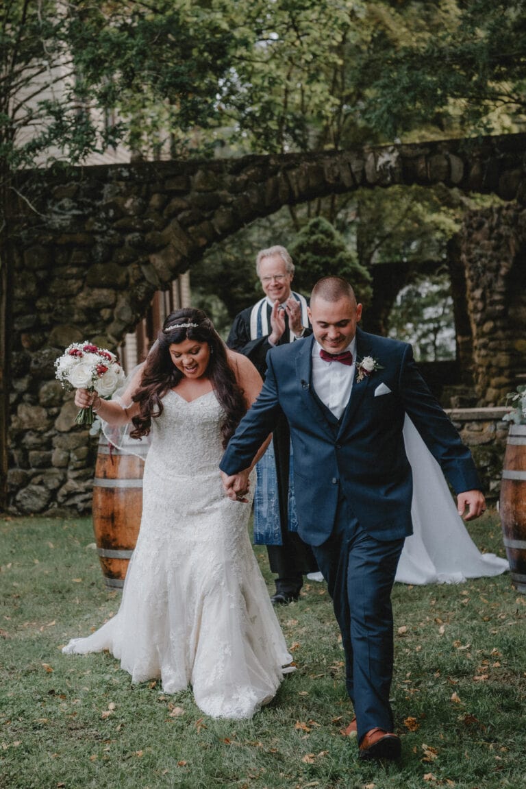Bride and Groom walk down aisle during Ceremony at a Hudson Valley Wedding at Brotherhood Winery