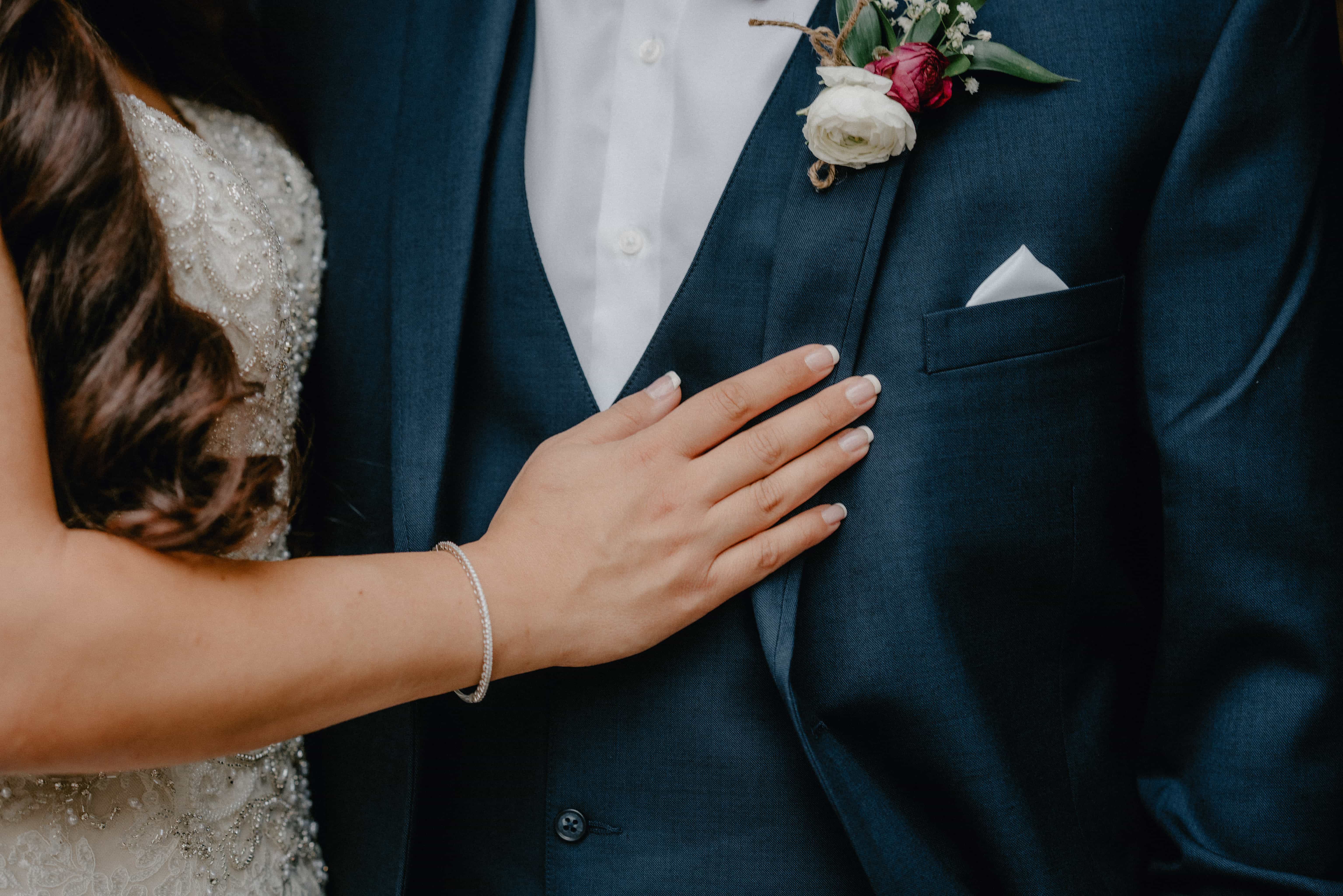 Bride hold hand on groom at a Hudson Valley Wedding at Brotherhood Winery