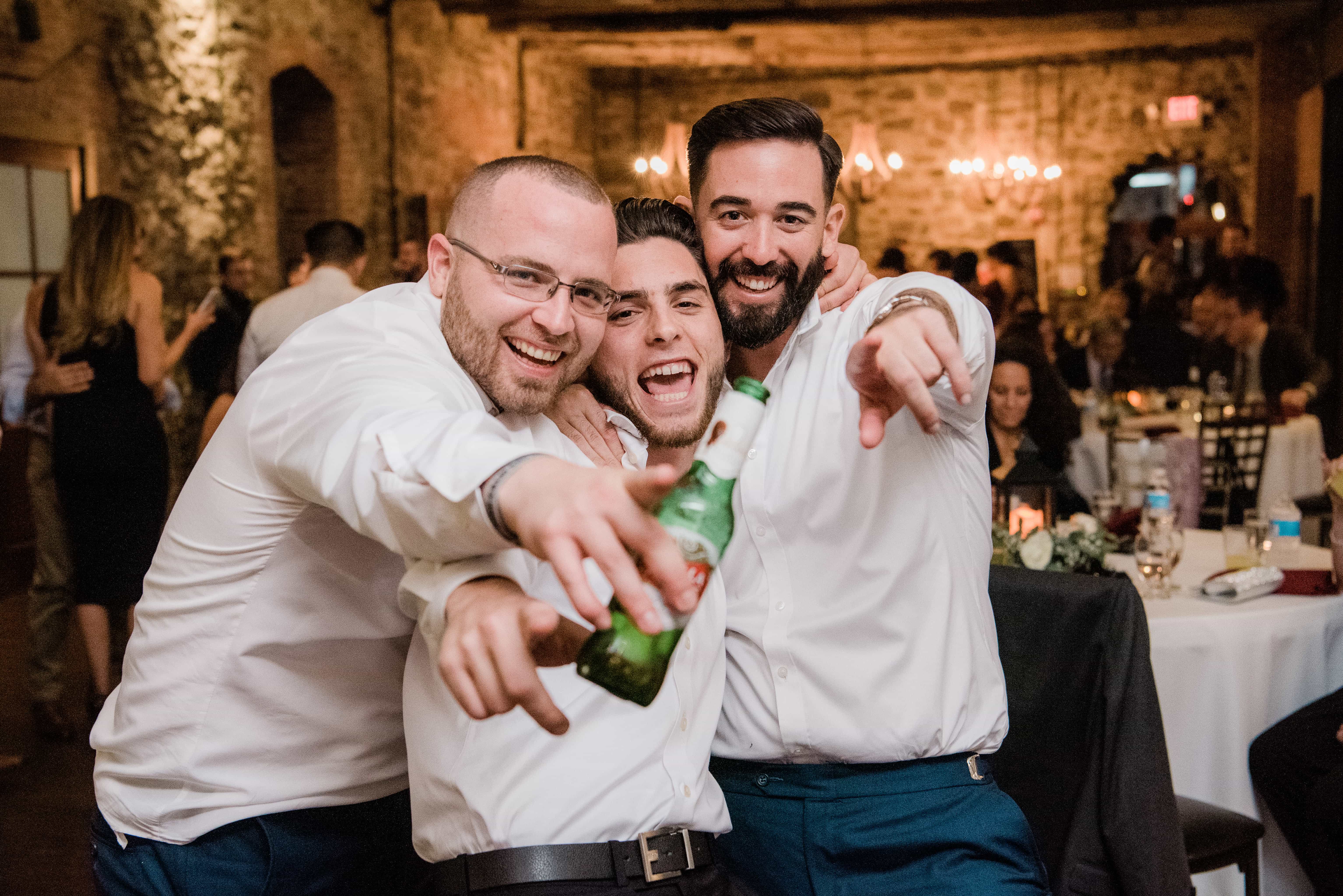 Guests have fun and point at a Hudson Valley Wedding at Brotherhood Winery