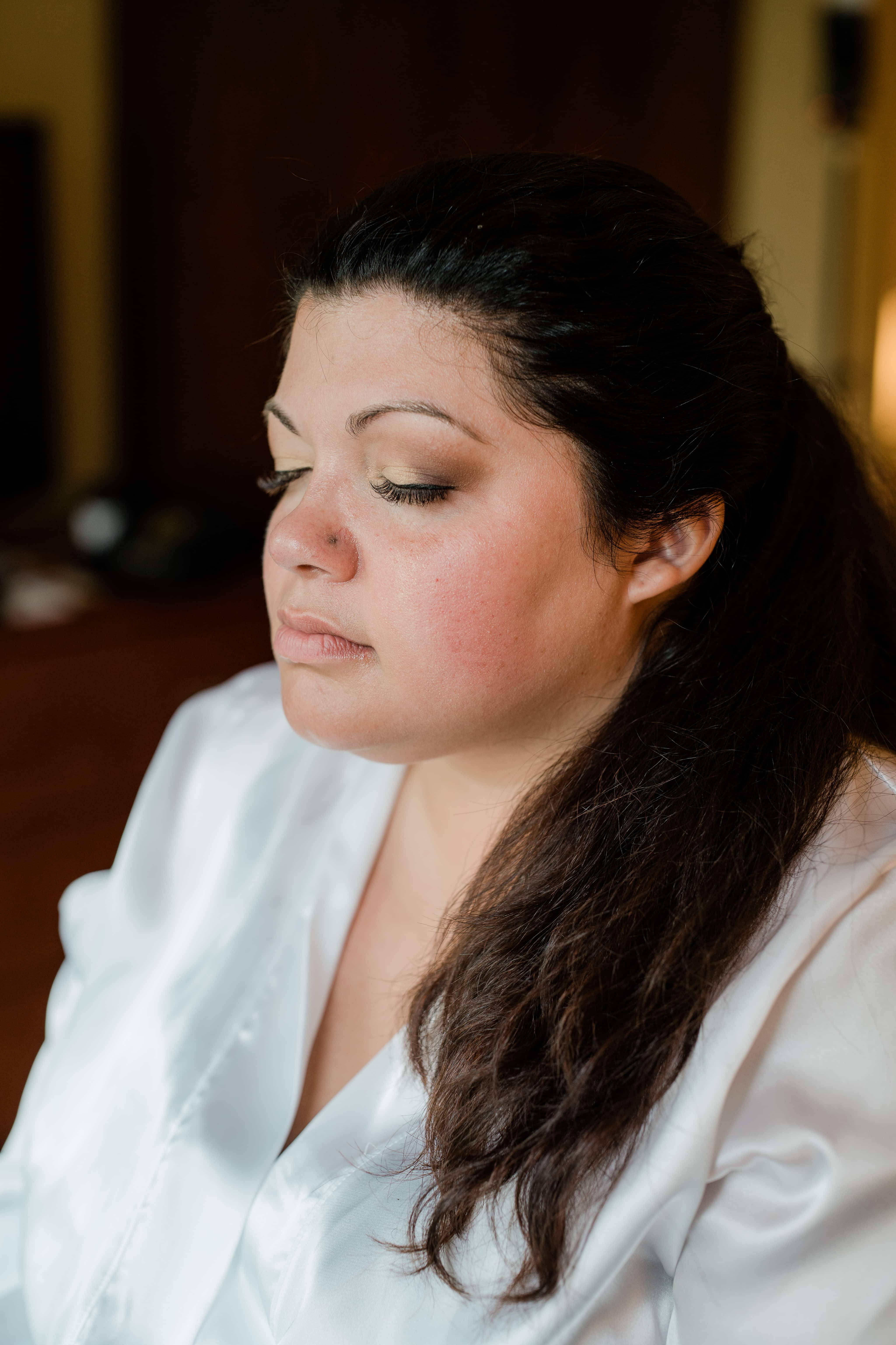 Bride gets ready for make up at a Hudson Valley Wedding at Brotherhood Winery