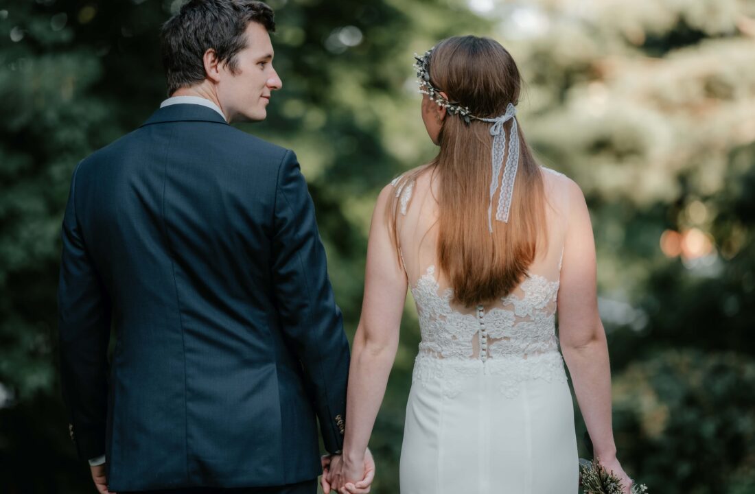 Bride and Groom hold hands at a Backyard Micro Wedding in Trumbull Connecticut