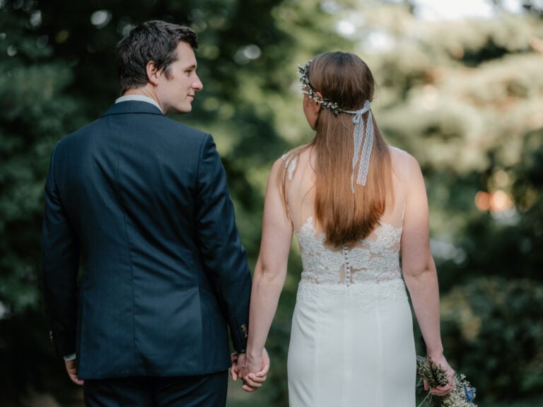 Bride and Groom hold hands at a Backyard Micro Wedding in Trumbull Connecticut