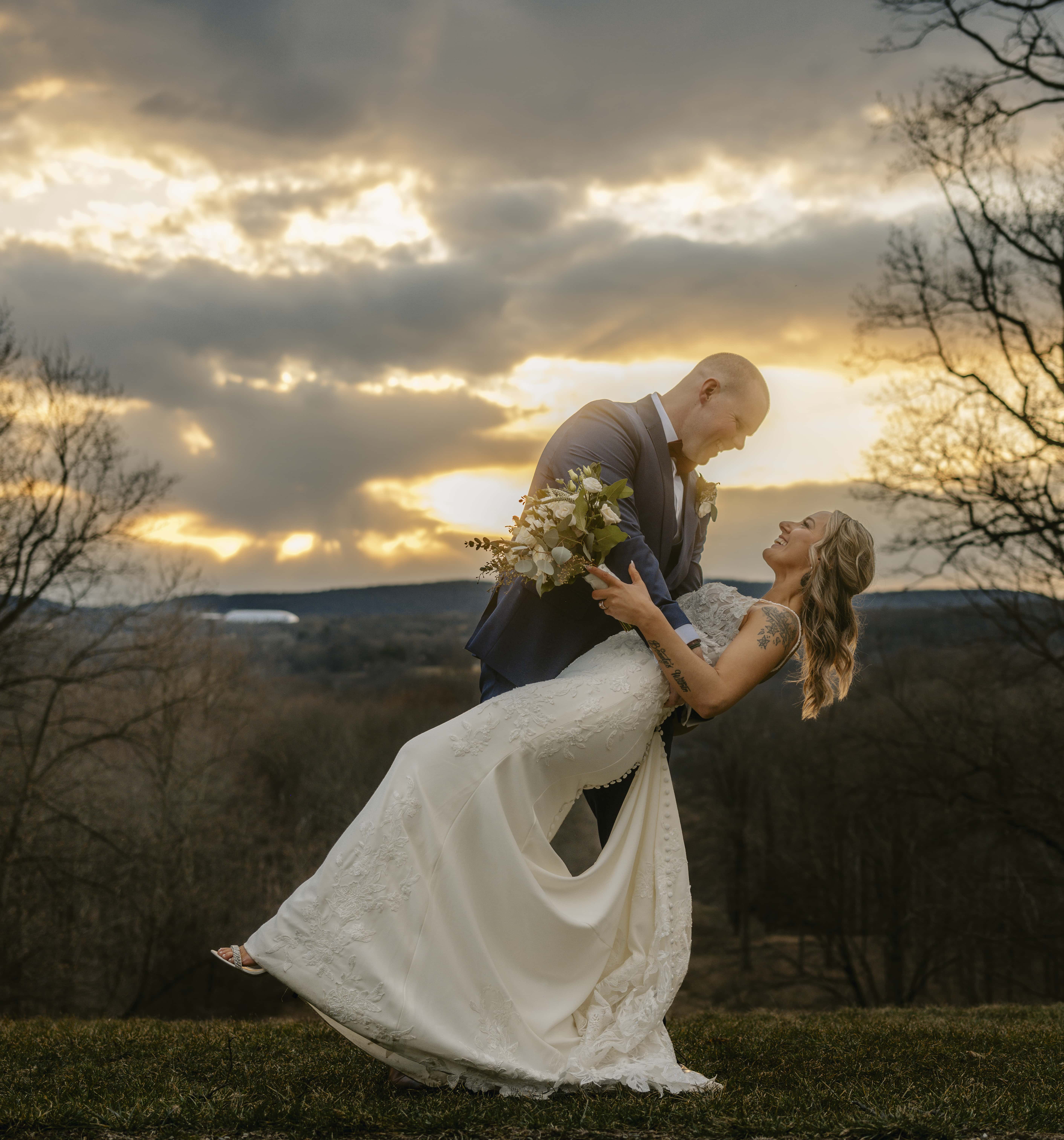Groom Dips Bride for a Sunset Photo at a Hudson Valley Wedding at Locust Grove Estate