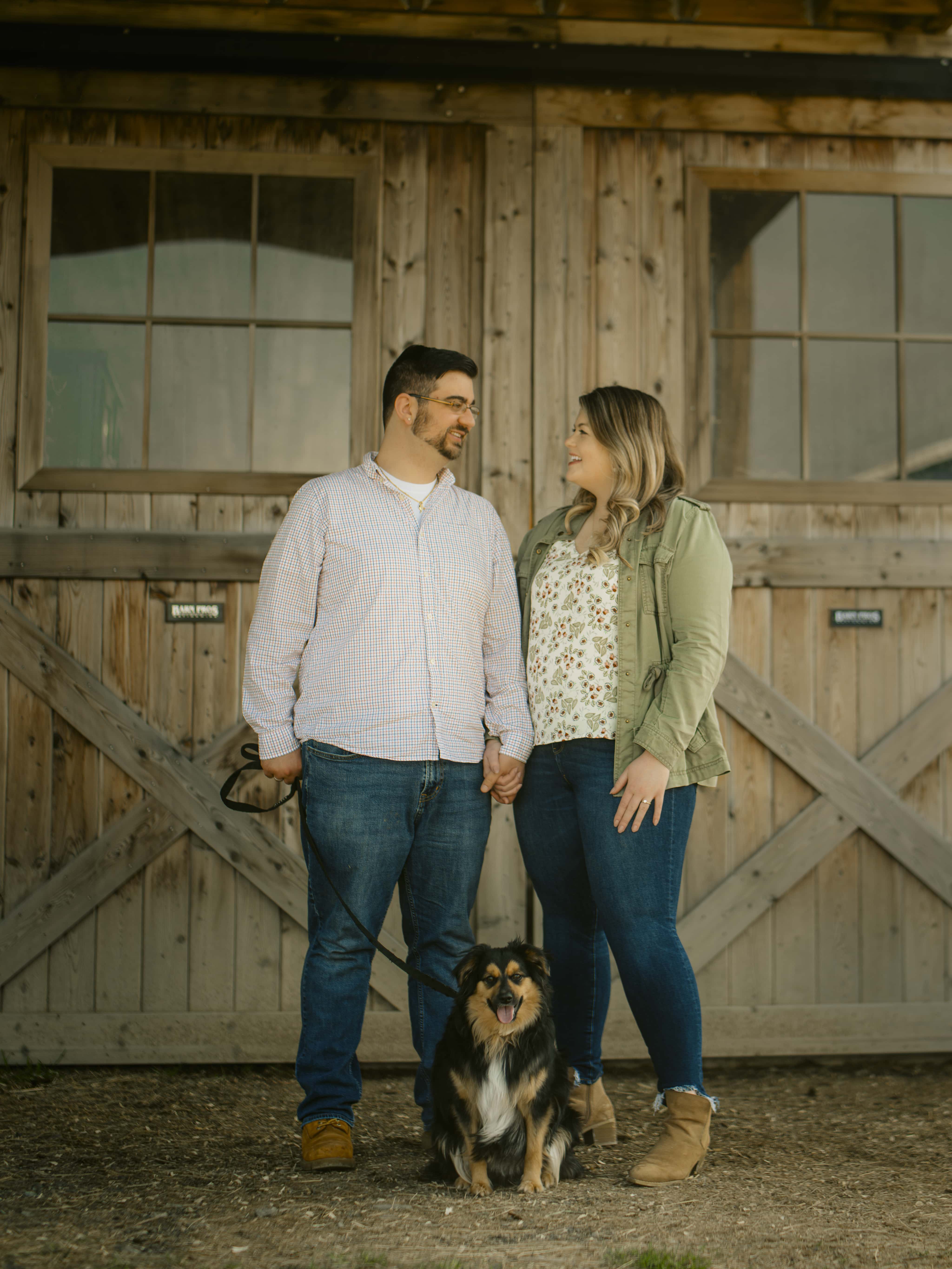 Bride and Groom look at eachother for Lake Minnewaska Engagement Photos in The Hudson Valley