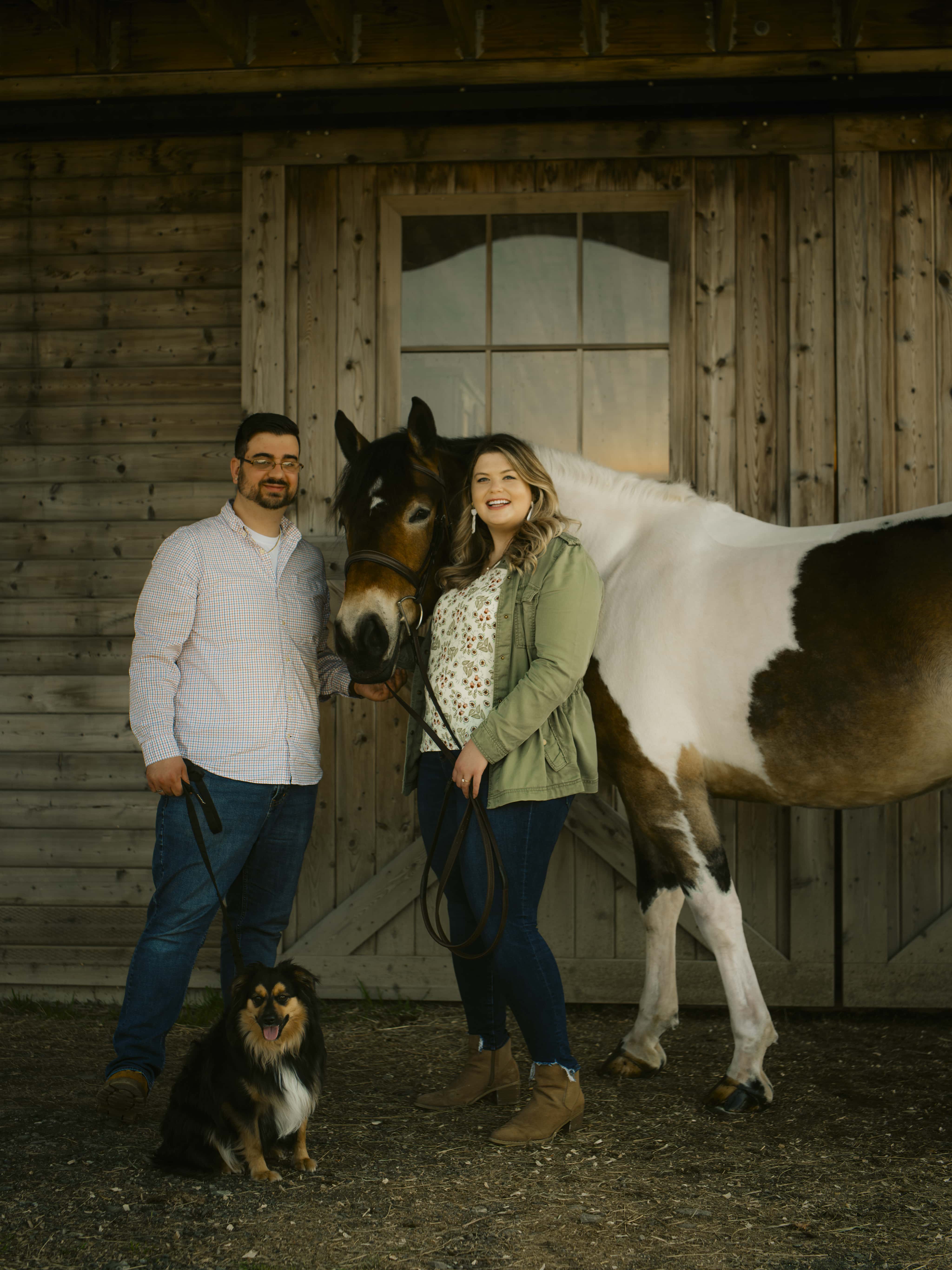 Bride and Groom pose with horse for Lake Minnewaska Engagement Photos in The Hudson Valley