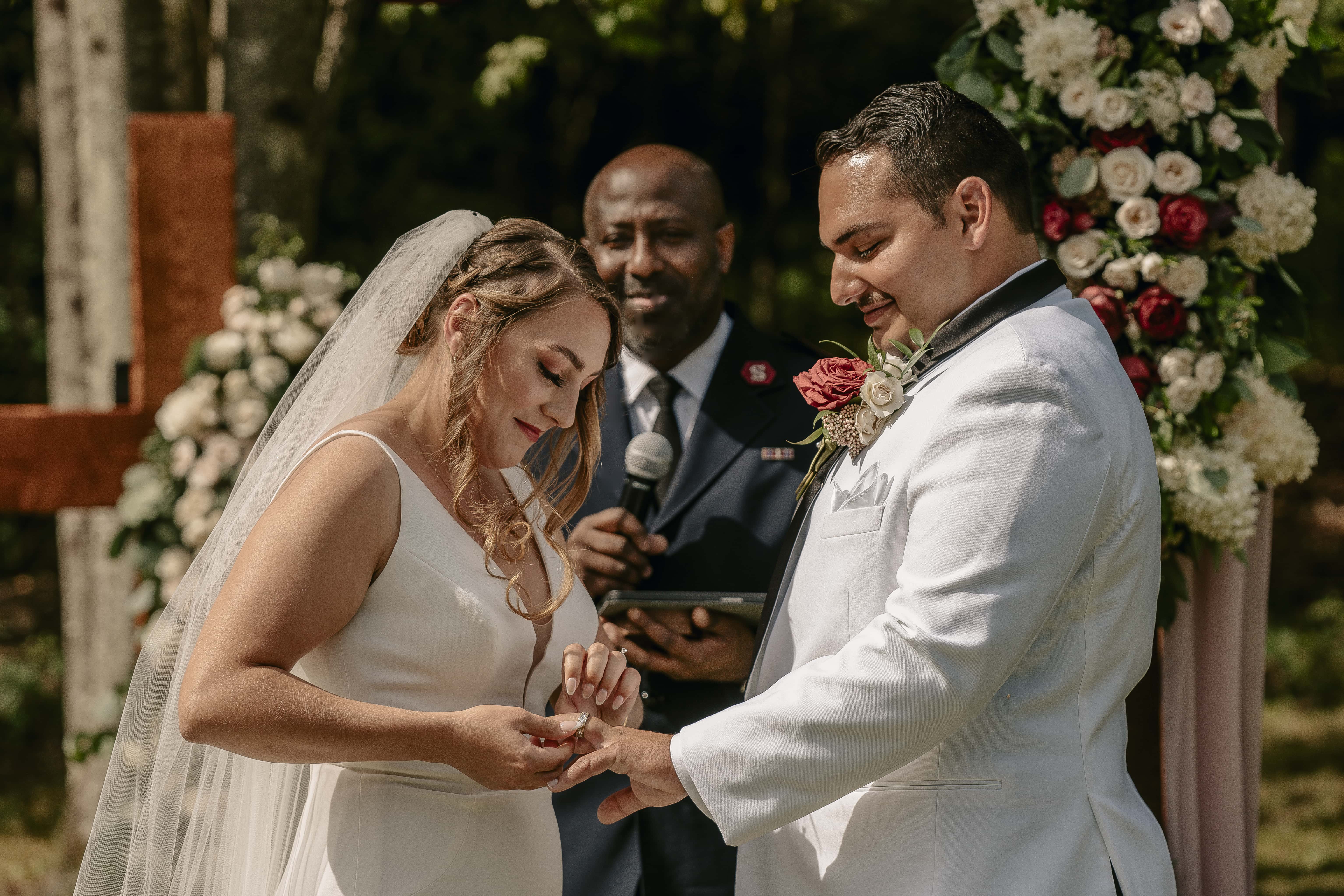 bride puts ring on groom during ceremony at an Upstate New York Wedding in the Hudson Valley
