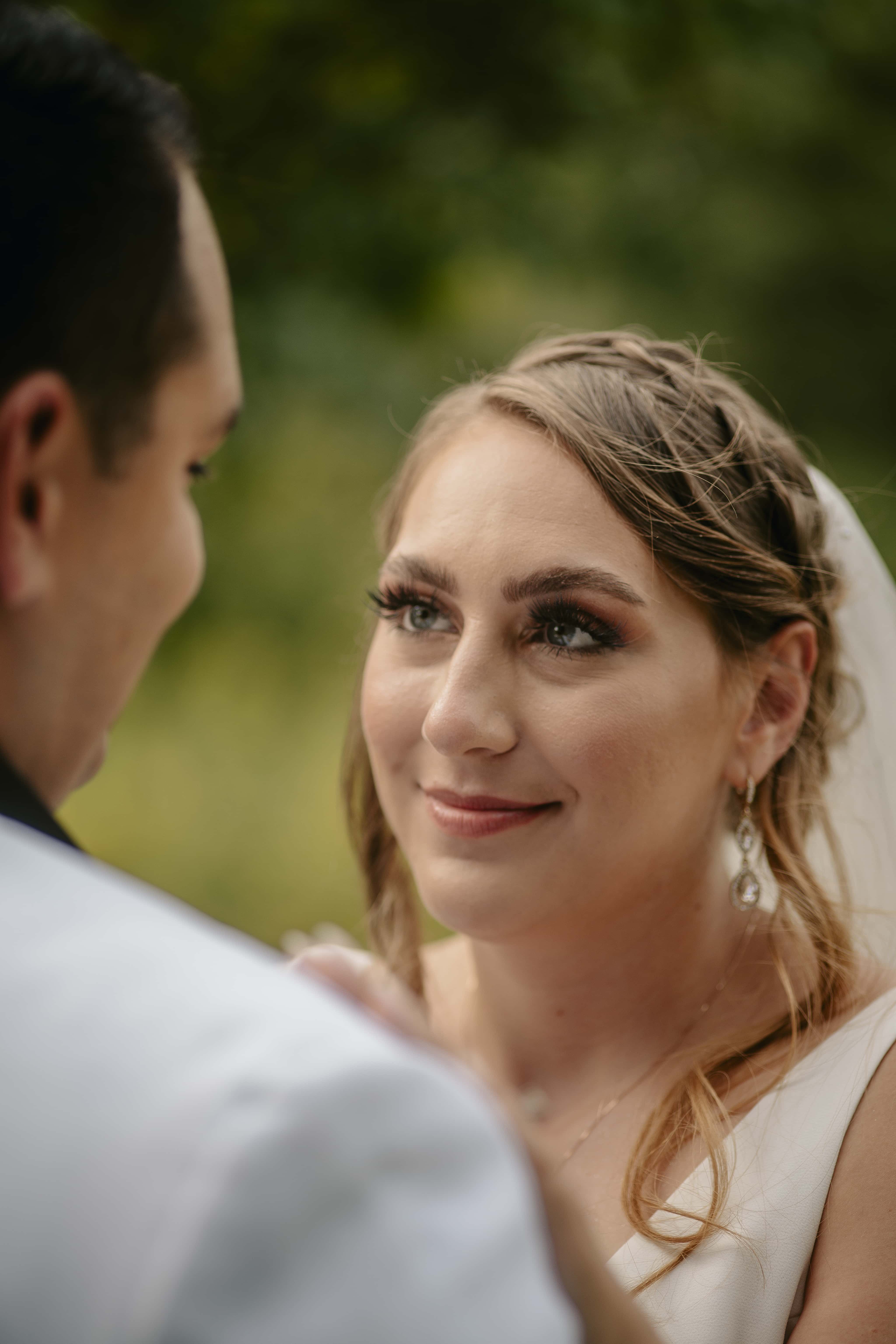 Bride smiles at groom during photo session at an Upstate New York Wedding in the Hudson Valley