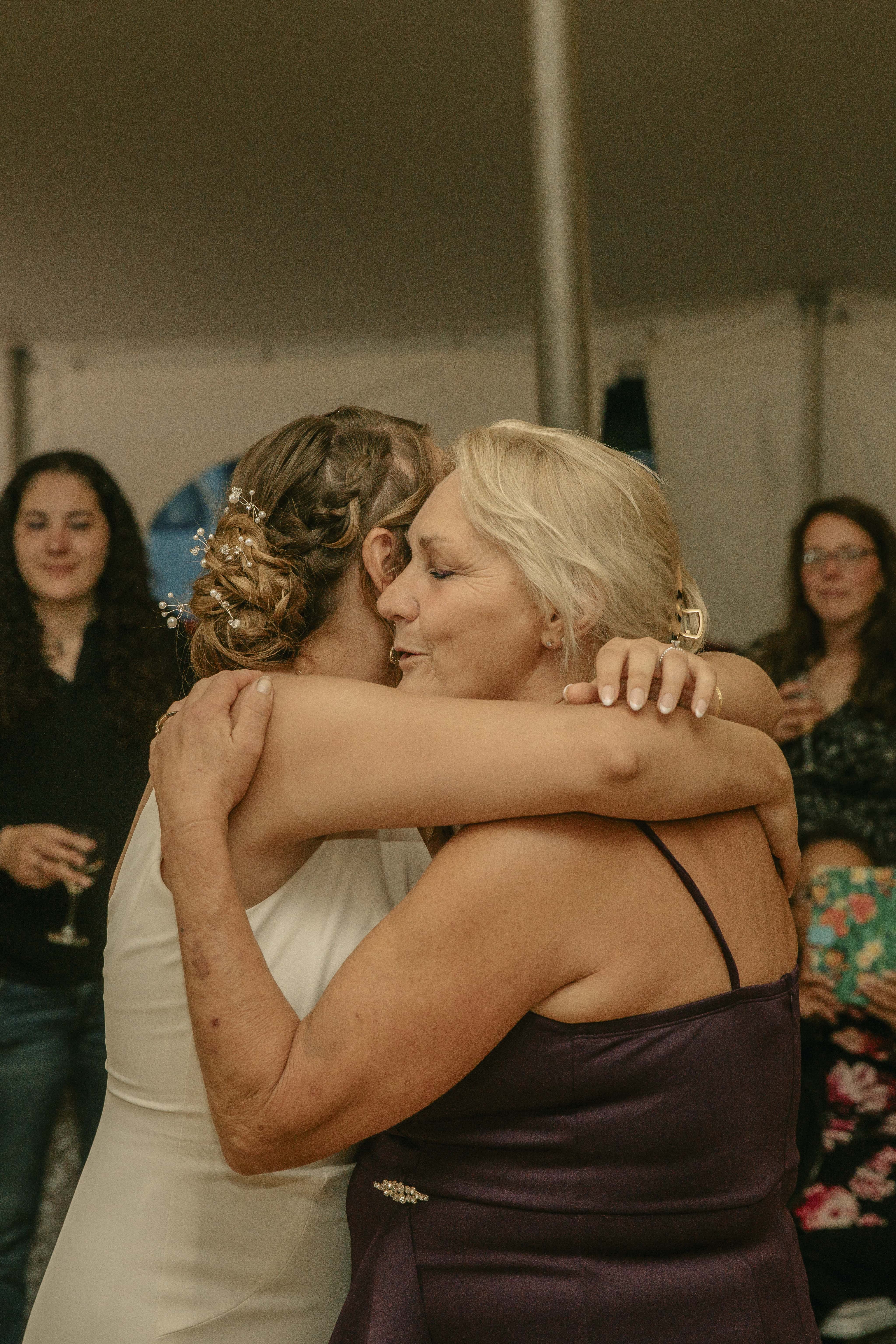 Bride hugs mother during reception at an Upstate New York Wedding in the Hudson Valley