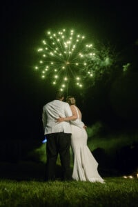 Bride and groom with green fireworks at an Upstate New York Wedding in the Hudson Valley