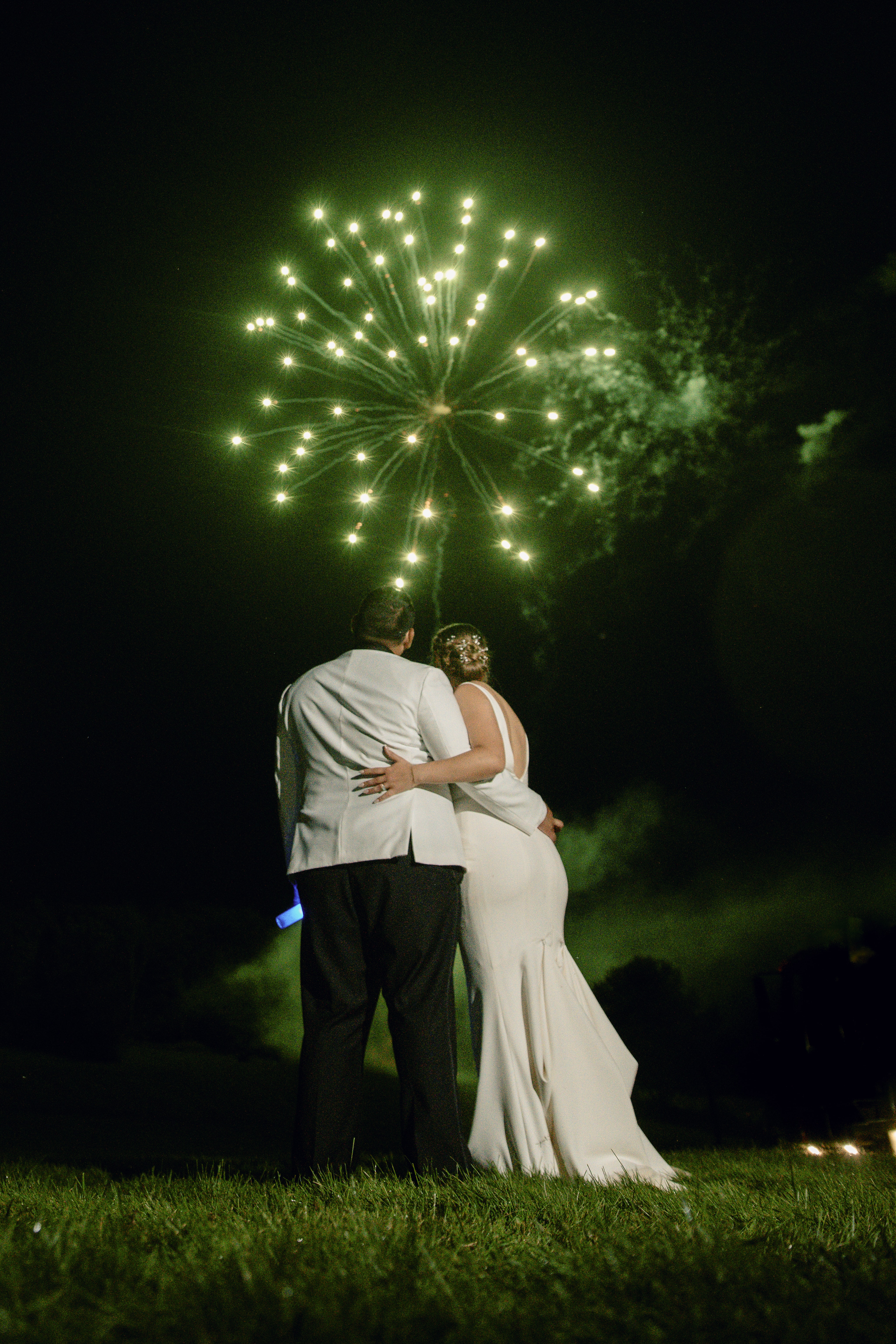 Bride and groom with green fireworks at an Upstate New York Wedding in the Hudson Valley