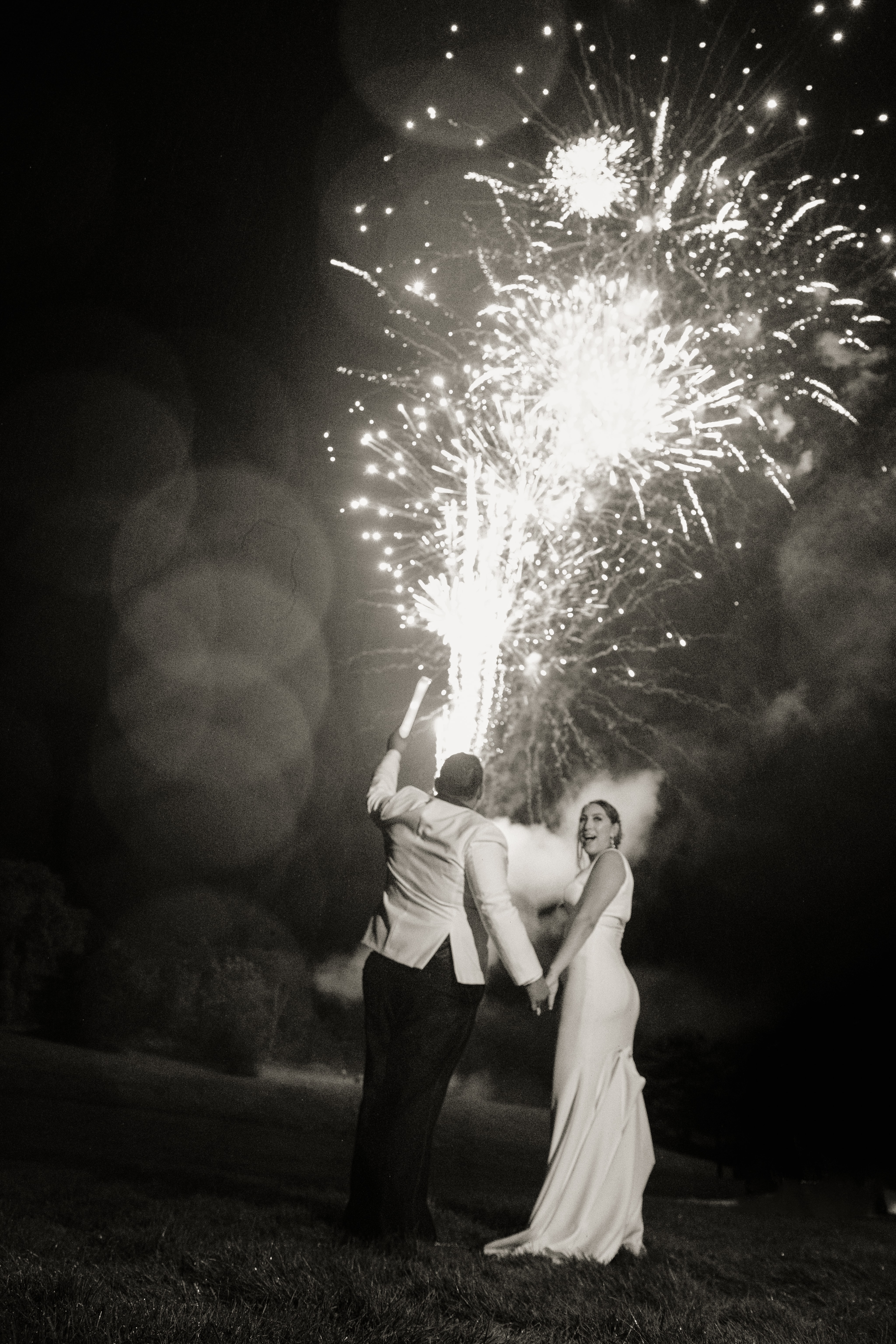 Black and White Photo of Bride and Groom celebrating with fireworks at an Upstate New York Wedding in the Hudson Valley
