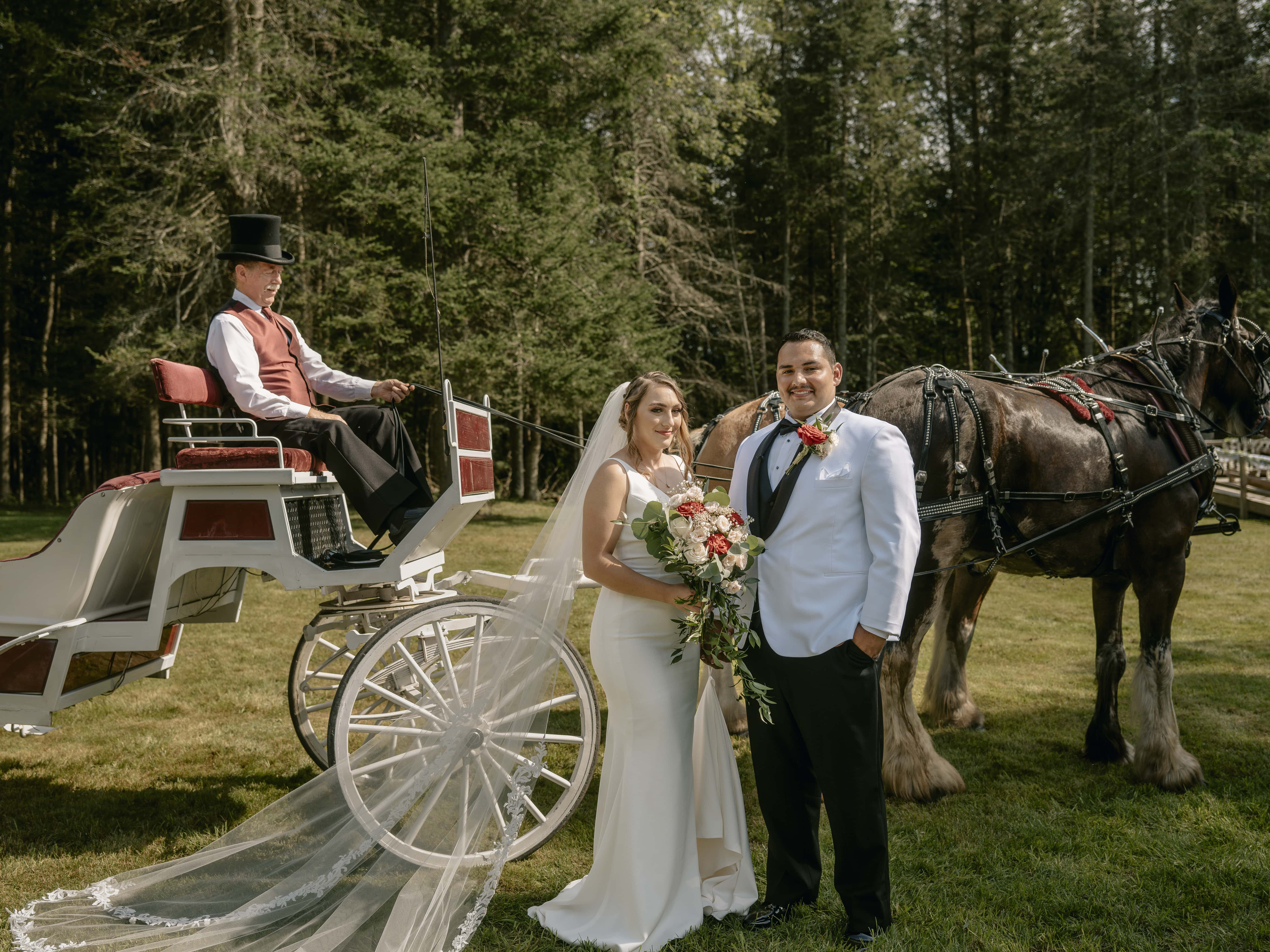 Bride and Groom by horse drawn carriage at an Upstate New York Wedding in the Hudson Valley