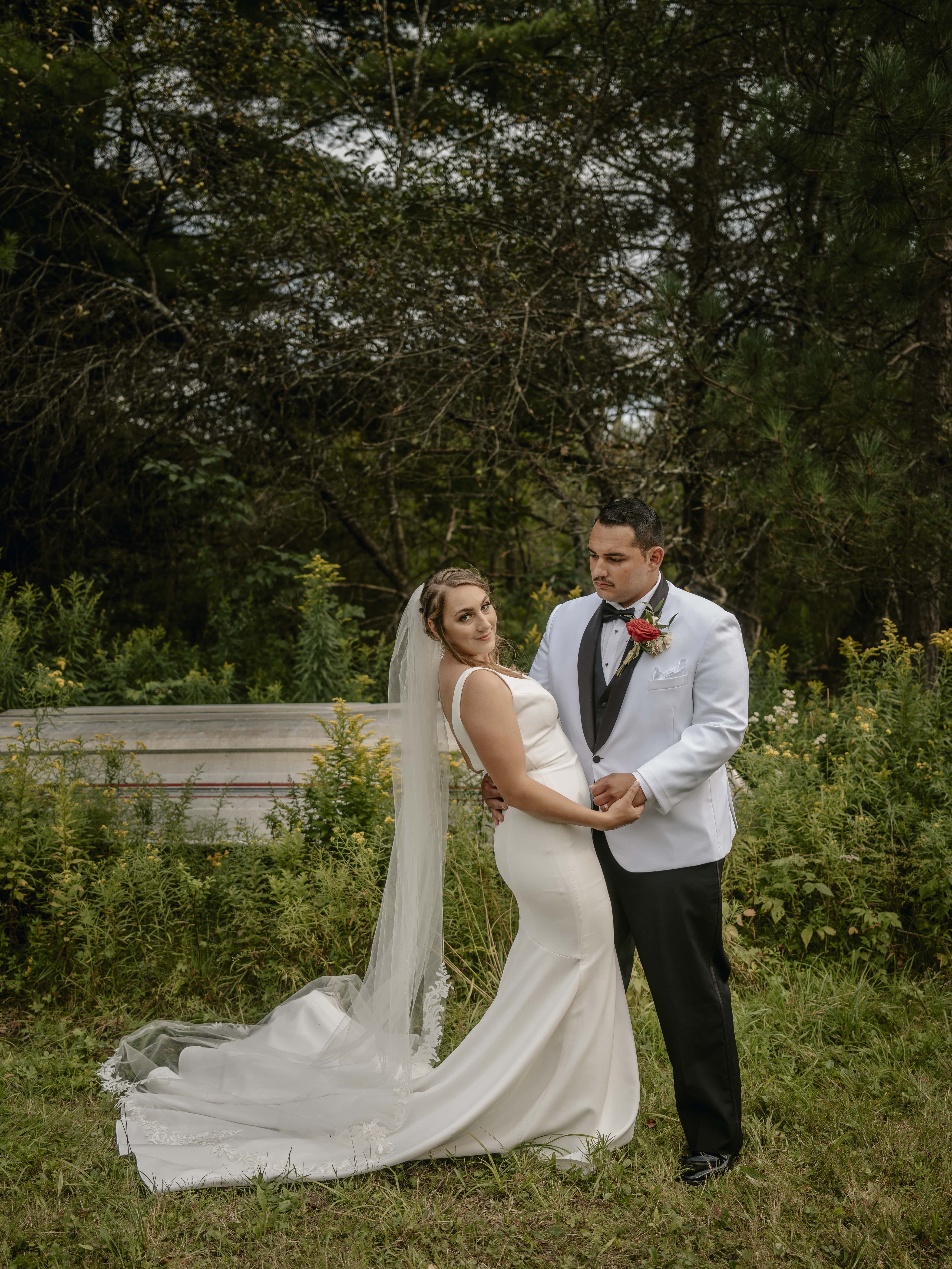 Bride smiles by boat at an Upstate New York Wedding in the Hudson Valley