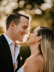 Bride and Groom smile at sunset during a Binney Park Engagement Shoot in Greenwich Connecticut