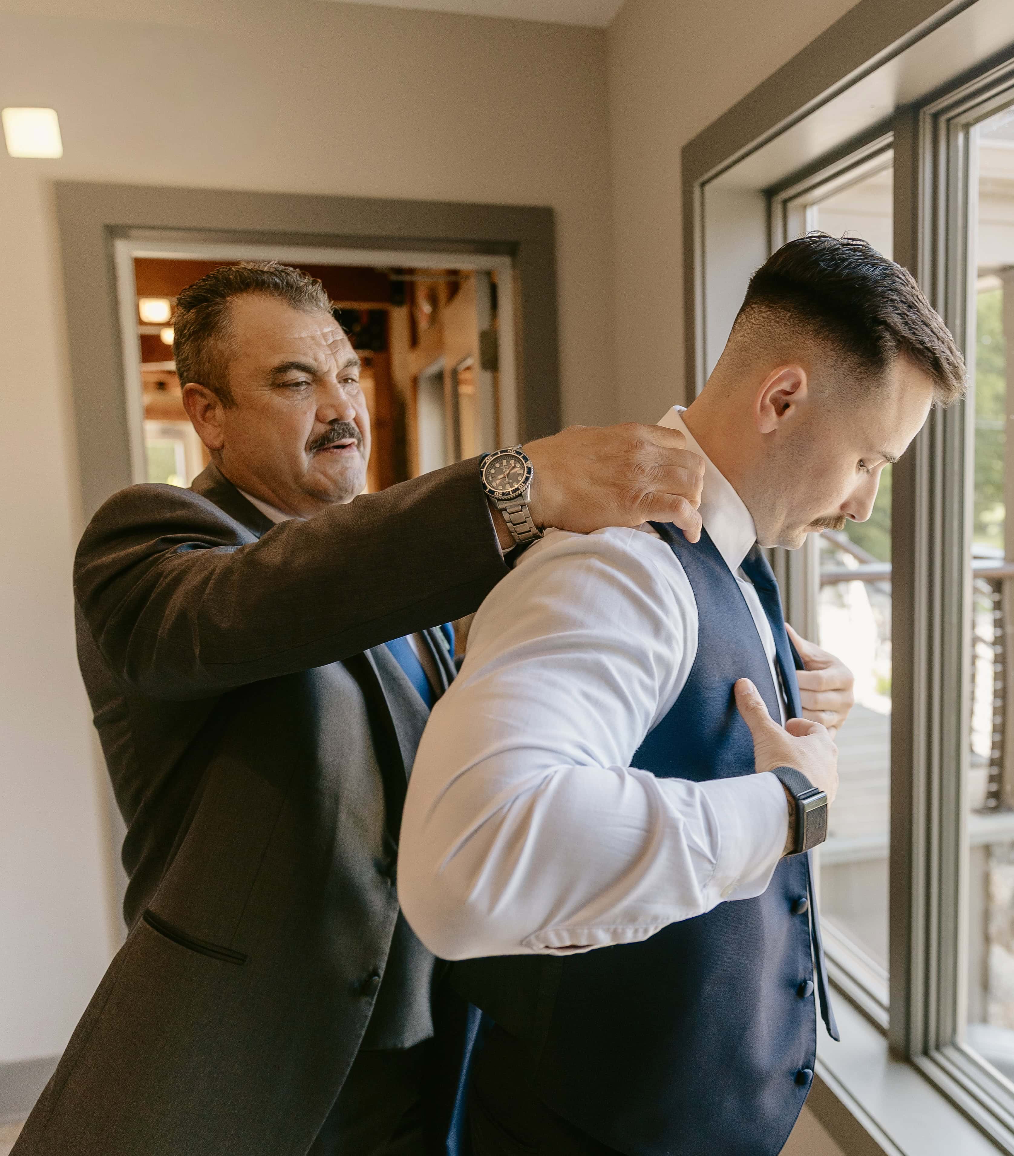 Father helps Groom Get Ready for a New Jersey Wedding Photo at Rock island Lake Club