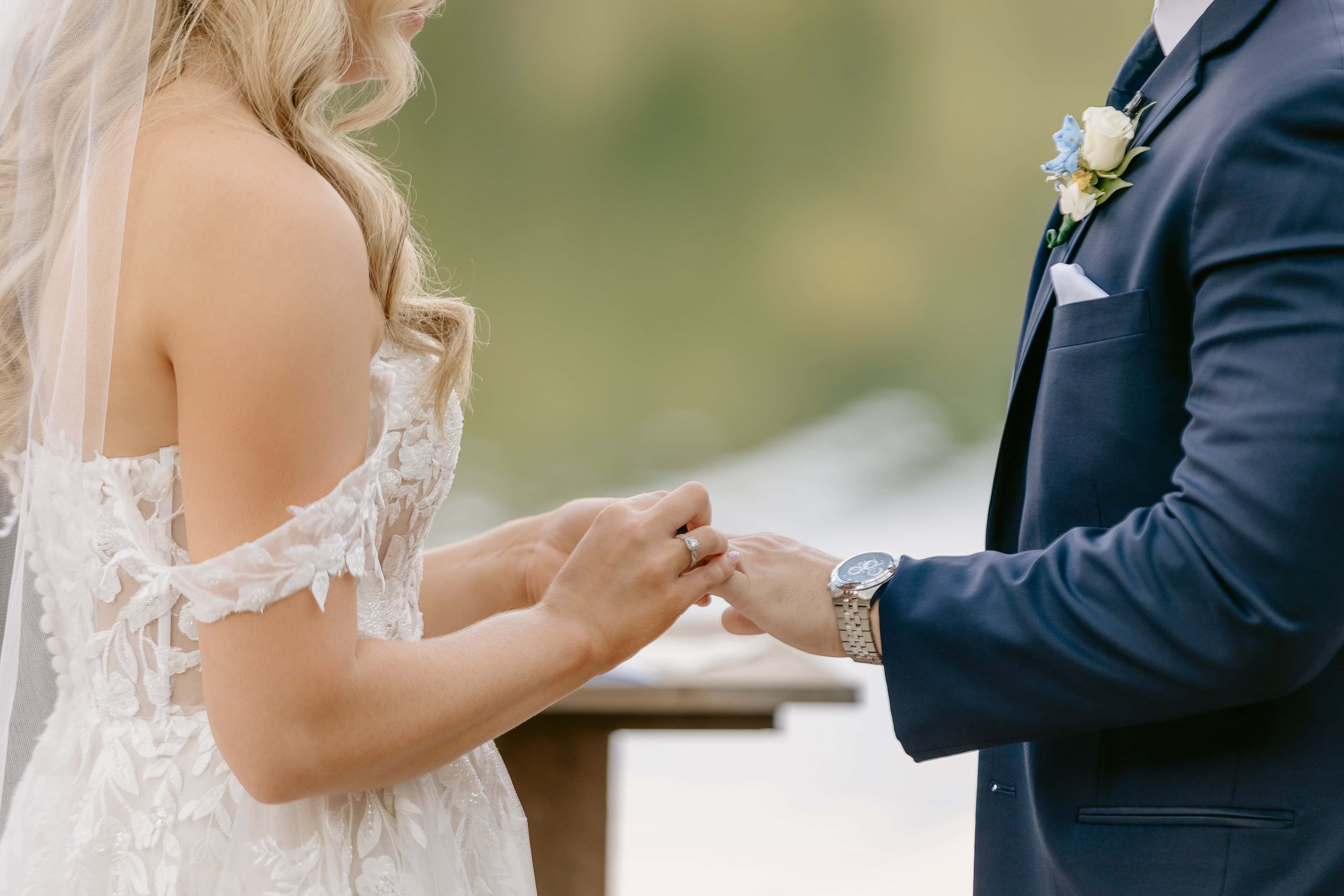 Bride puts ring on Groom during Ceremony for a New Jersey Wedding Photo at Rock island Lake Club