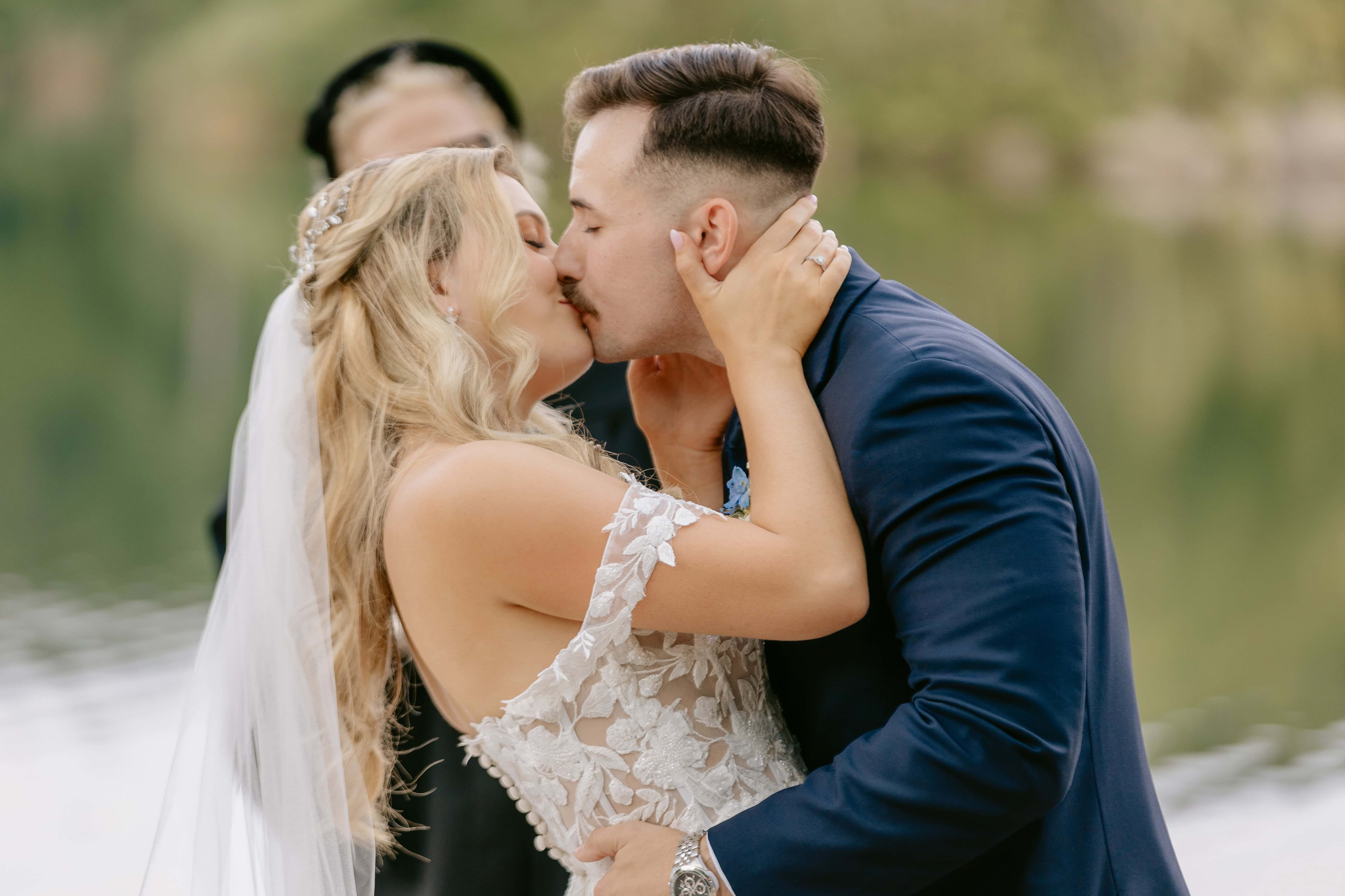 Bride and Grooms first Kiss during Ceremony for a New Jersey Wedding Photo at Rock island Lake Club