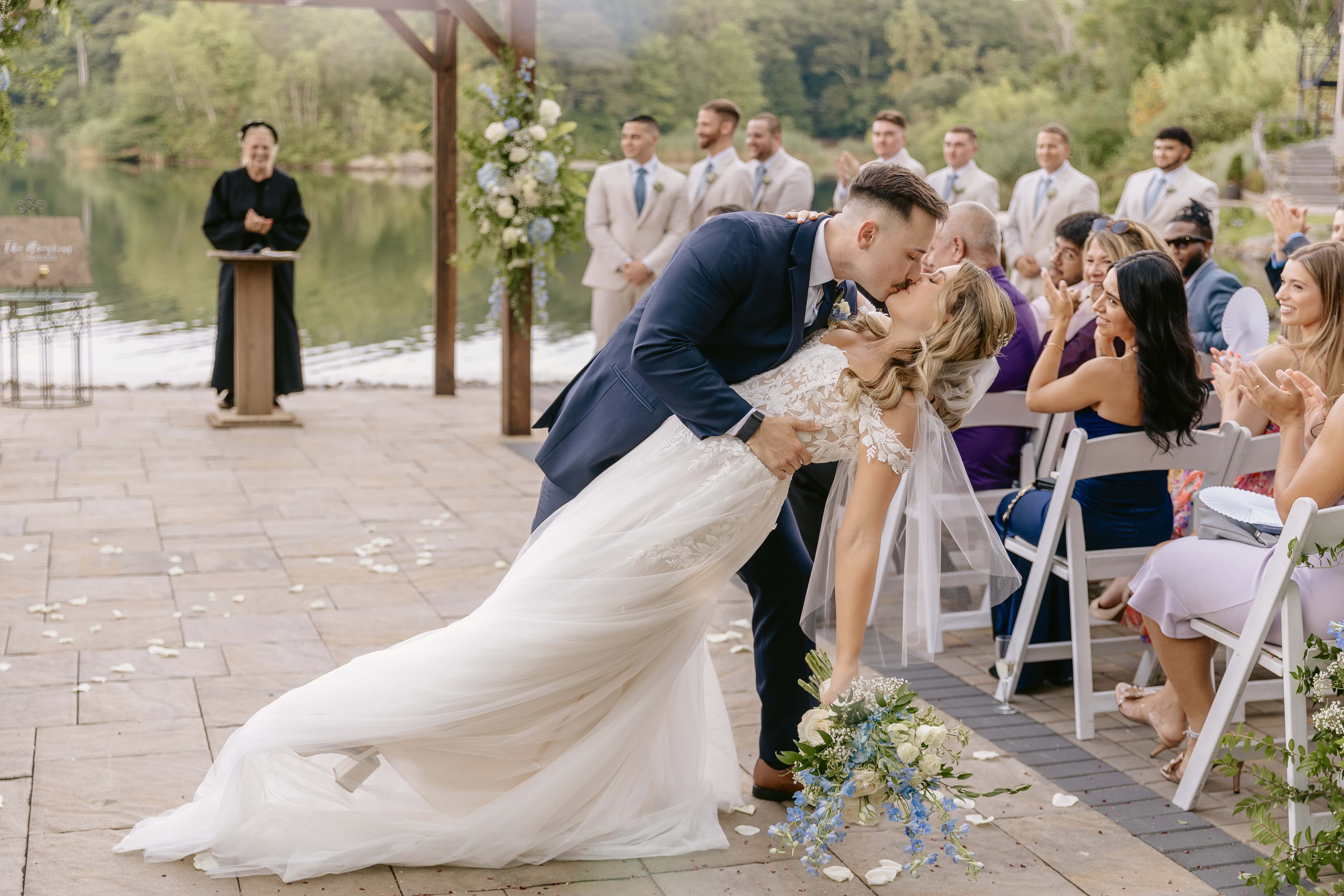 Bride and Groom Dip Kiss during Ceremony for a New Jersey Wedding Photo at Rock island Lake Club