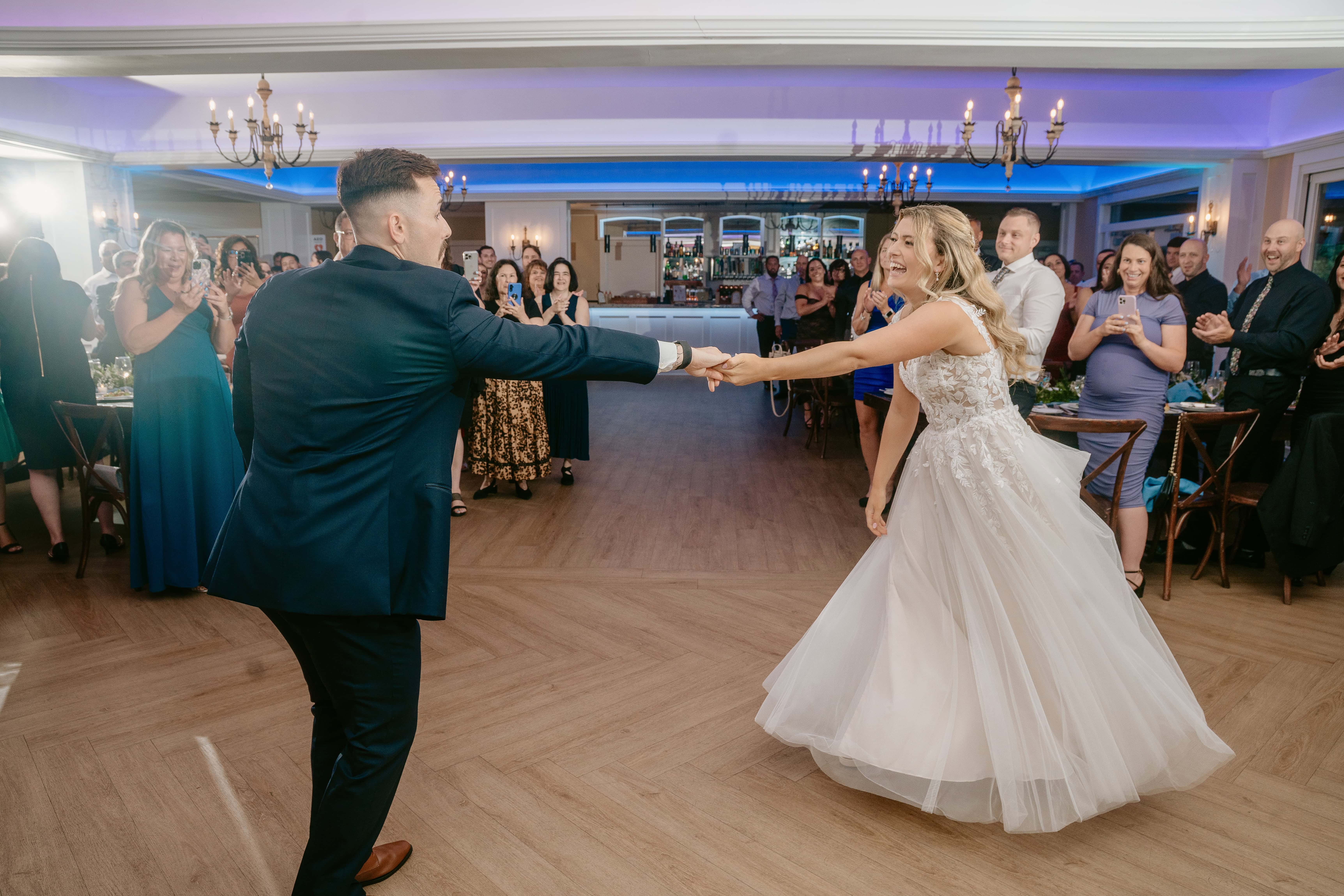 Groom twirls Bride for First Dance for a New Jersey Wedding Photo at Rock island Lake Club