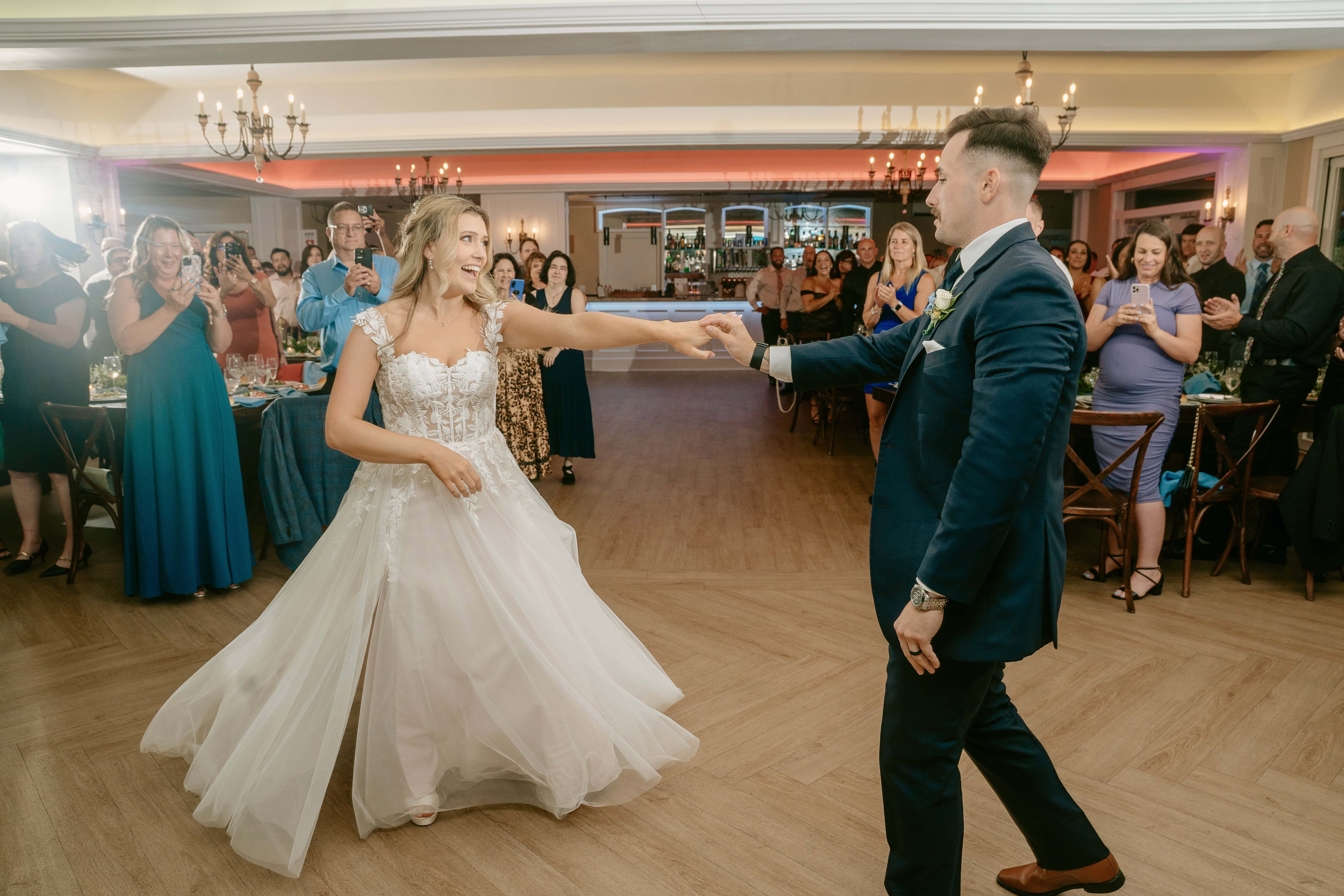 Bride twirls groom during first dance for a New Jersey Wedding Photo at Rock island Lake Club