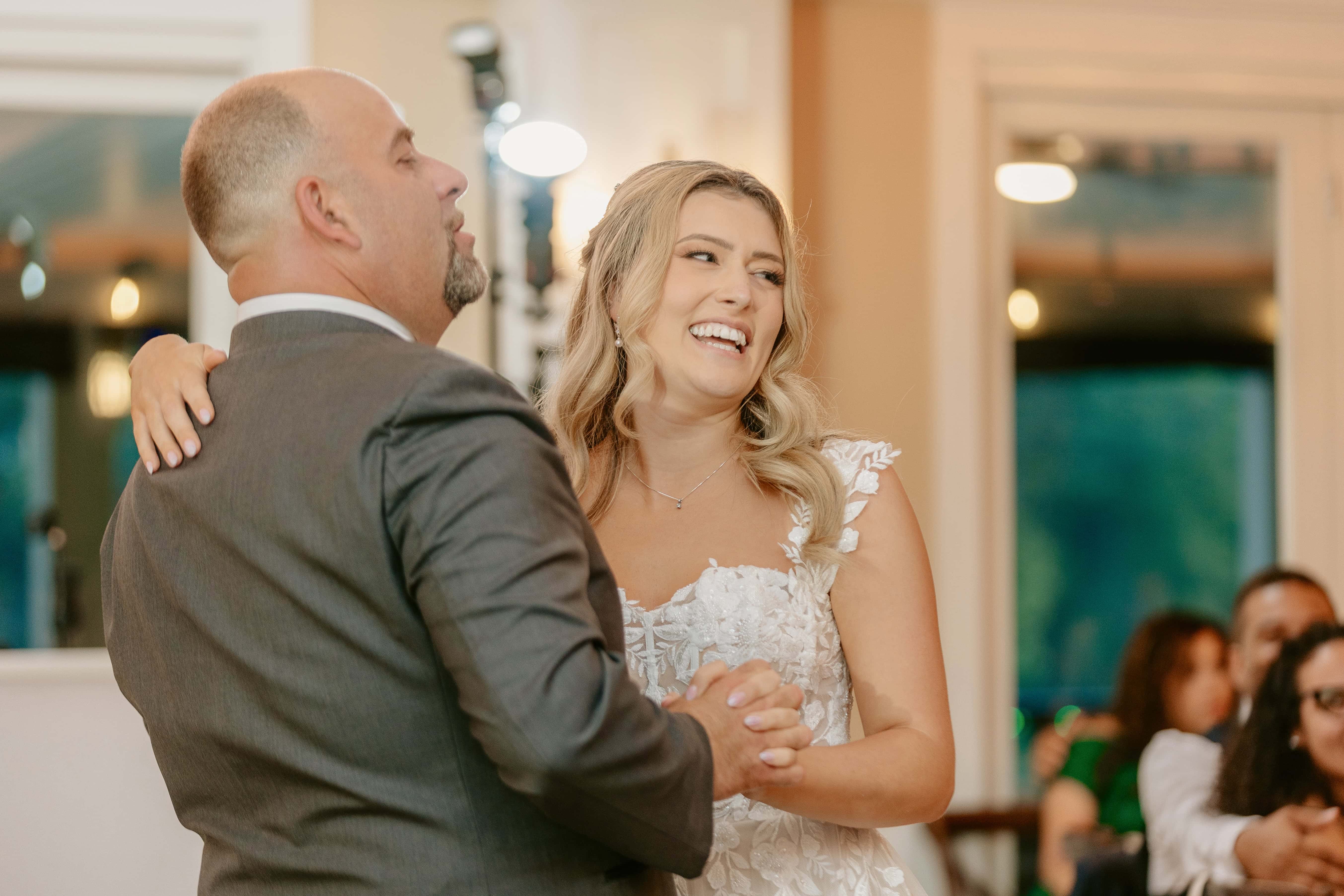 Bride smiles during father daughter dance for a New Jersey Wedding Photo at Rock island Lake Club