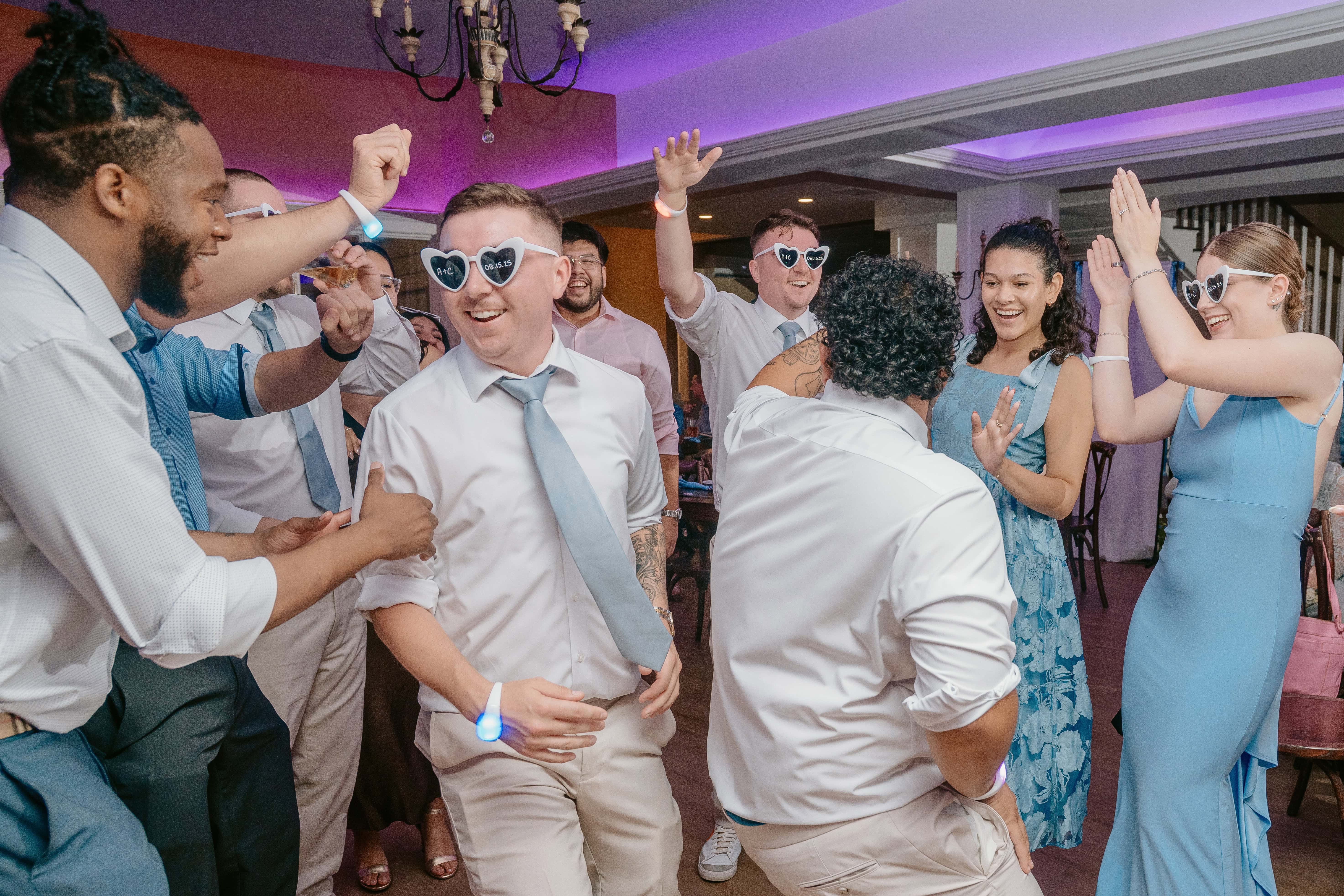 Wedding Guests Dancing and smiling for a New Jersey Wedding Photo at Rock island Lake Club