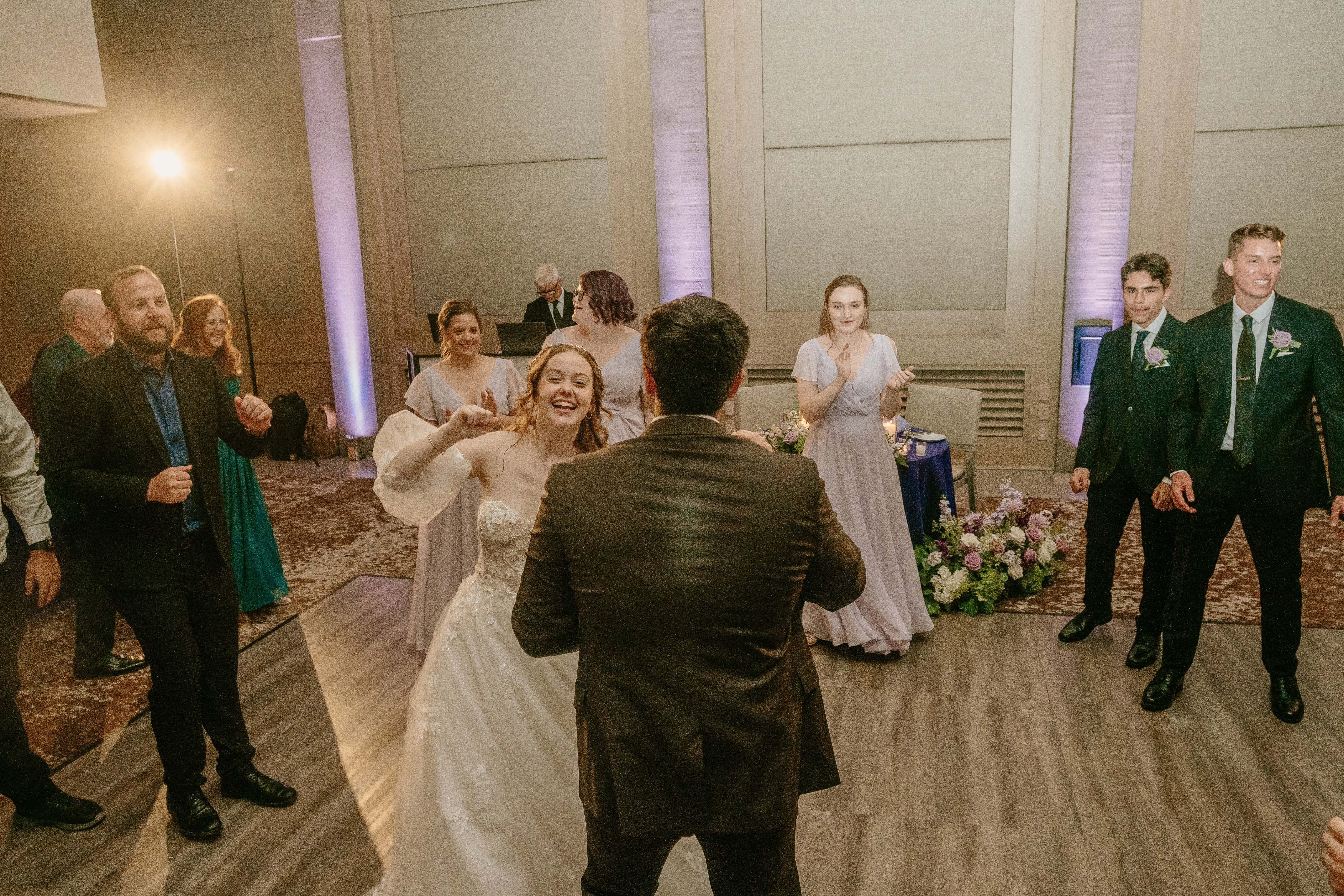Bride Smiles and Dances with Groom for a Hudson Valley Wedding Photo at The Eldred Preserve in the Catskills