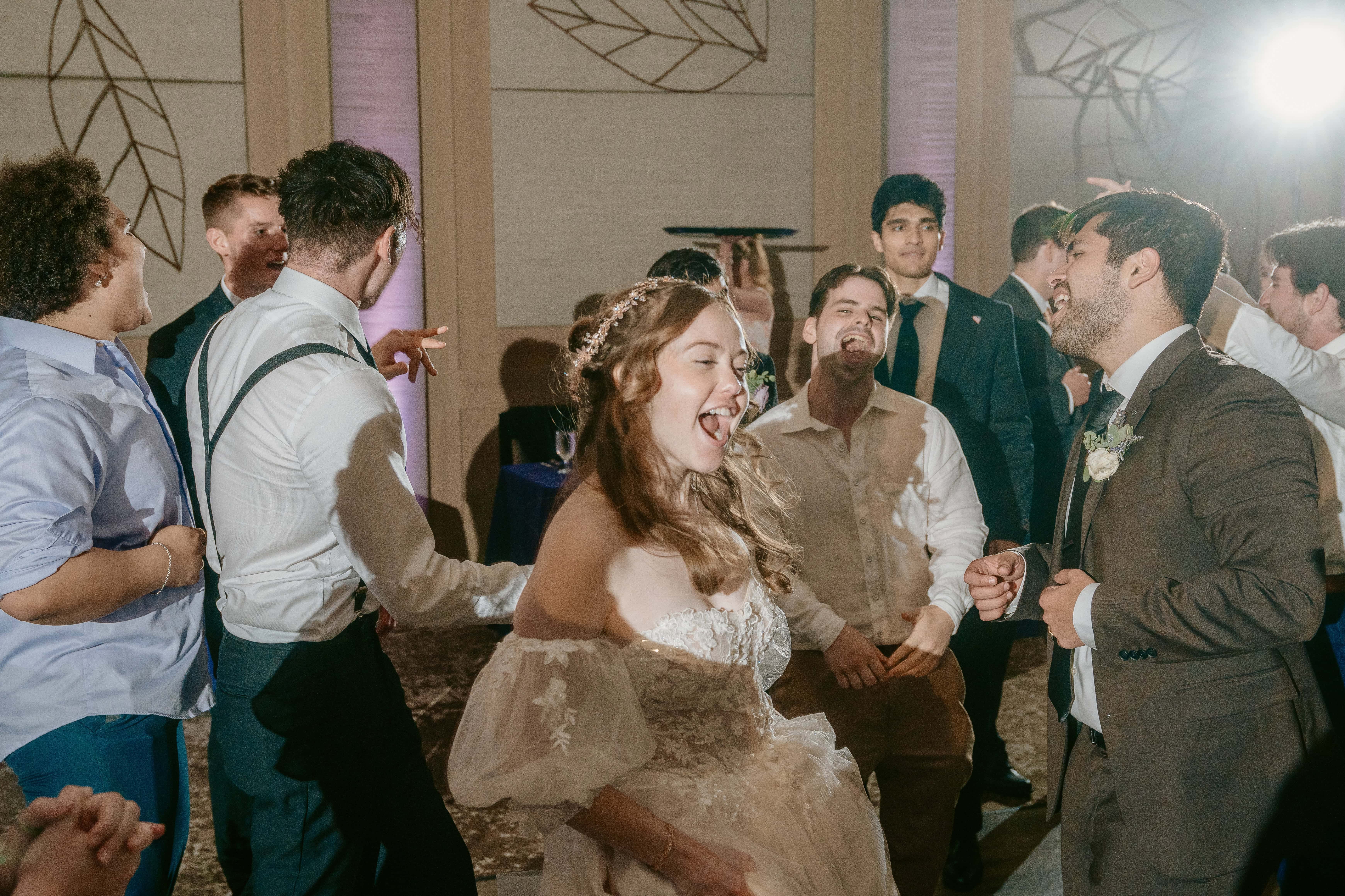 Bride smiles while Dancing for a Hudson Valley Wedding Photo at The Eldred Preserve in the Catskills